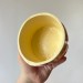 Small light beige crochet yarn bowl with pastel retro daisy