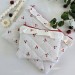 Laptop sleeve with cherries and ruffles