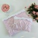 Soft pink laptop sleeve with ruffles, bows and pearl-like beads
