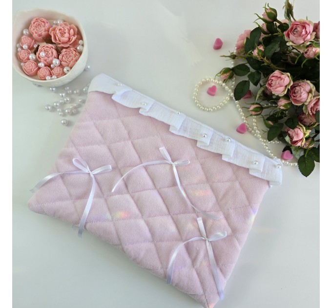 Soft pink laptop sleeve with ruffles, bows and pearl-like beads
