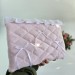 Soft pink laptop sleeve with ruffles, bows and pearl-like beads