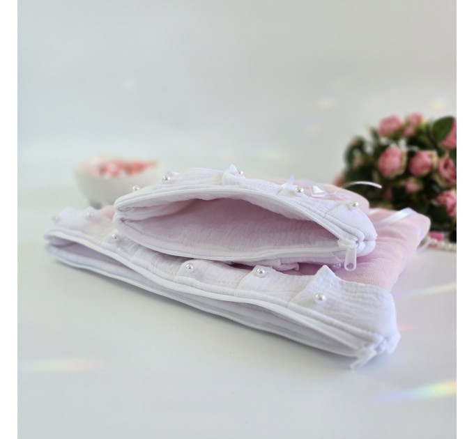Soft pink laptop sleeve with ruffles, bows and pearl-like beads