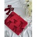 Red velvet laptop sleeve with bows