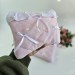 Soft pink tablet sleeve with ruffles, bows and pearl-like beads