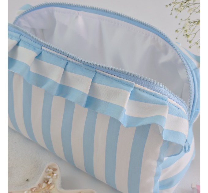 Large sky-blue striped cosmetic bag with ruffles