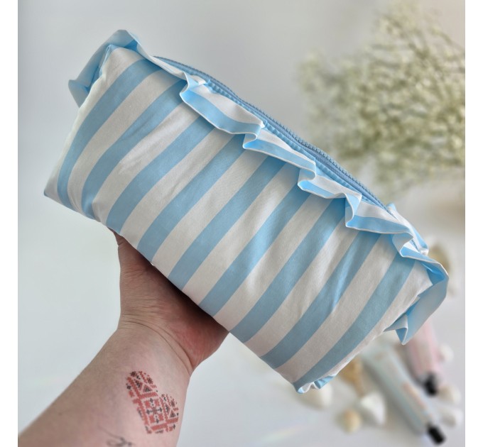 Large sky-blue striped cosmetic bag with ruffles