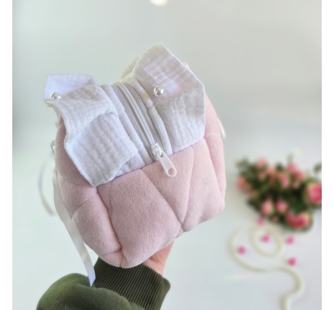 Large soft pink cosmetic bag with ruffles, bows and pearl-like beads