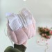 Large soft pink cosmetic bag with ruffles, bows and pearl-like beads