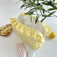 Large yellow striped cosmetic bag with ruffles
