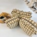 Medium checkered brown cosmetic bag with ruffles