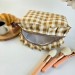Medium checkered brown cosmetic bag with ruffles