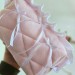 Medium soft pink cosmetic bag with ruffles, bows and pearl-like beads