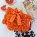 Grapefruit Orange Book Sleeve with ruffles on ties 