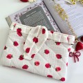Strawberry book sleeve with ruffles on ties 