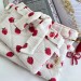 Strawberry book sleeve with ruffles on ties 