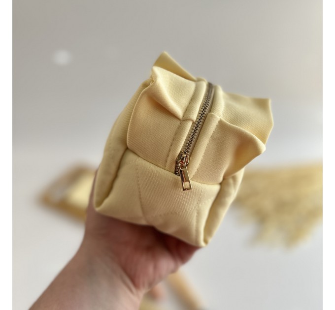 Small butter yellow cosmetic bag with ruffles