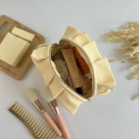 Small butter yellow cosmetic bag with ruffles