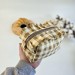 Small checkered brown cosmetic bag with ruffles