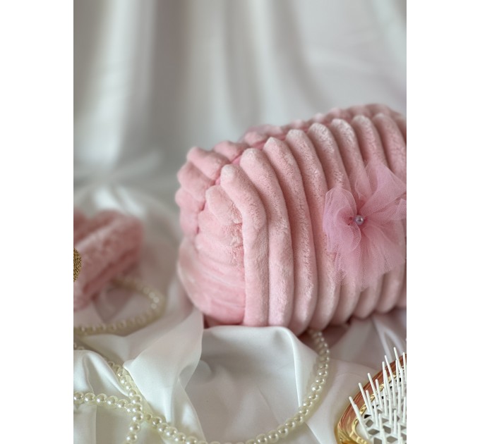 Small pink plush cosmetic bag with bows