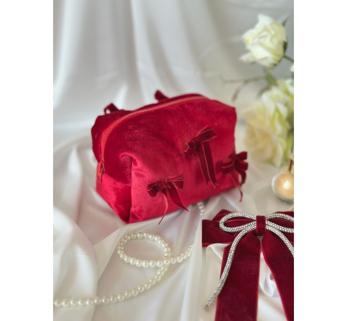 Small red velvet cosmetic bag with bows