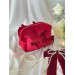 Small red velvet cosmetic bag with bows