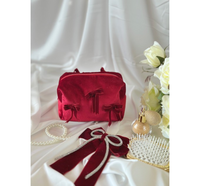 Small red velvet cosmetic bag with bows
