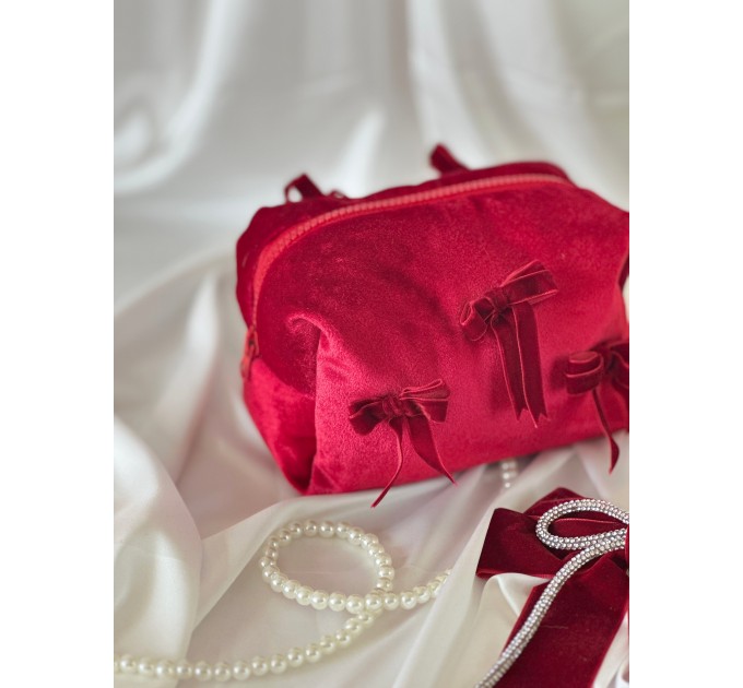 Small red velvet cosmetic bag with bows