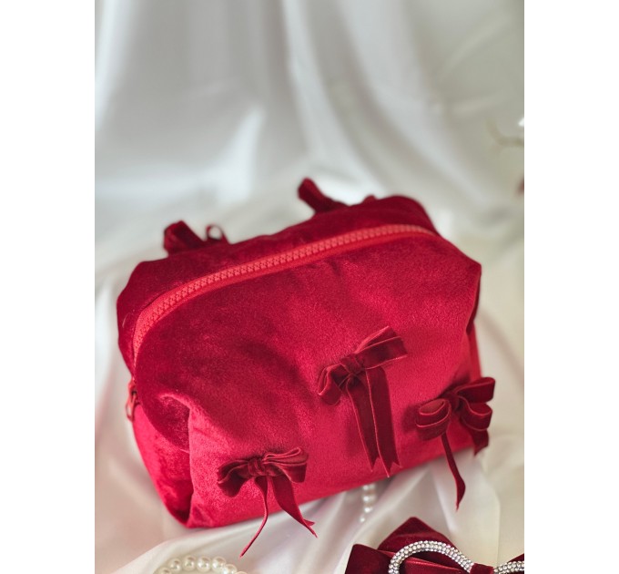 Small red velvet cosmetic bag with bows