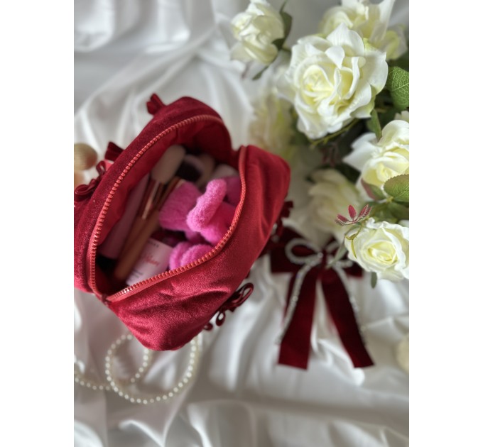 Small red velvet cosmetic bag with bows