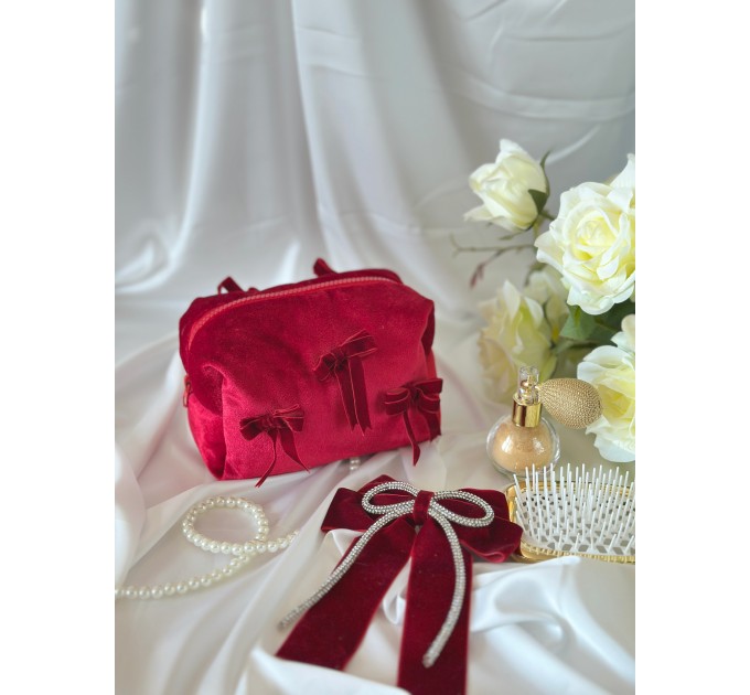 Small red velvet cosmetic bag with bows