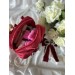 Small red velvet cosmetic bag with bows