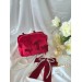 Small red velvet cosmetic bag with bows