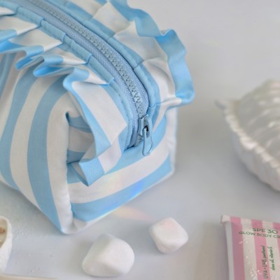 Small sky-blue striped cosmetic bag with ruffles