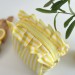 Small yellow striped cosmetic bag with ruffles