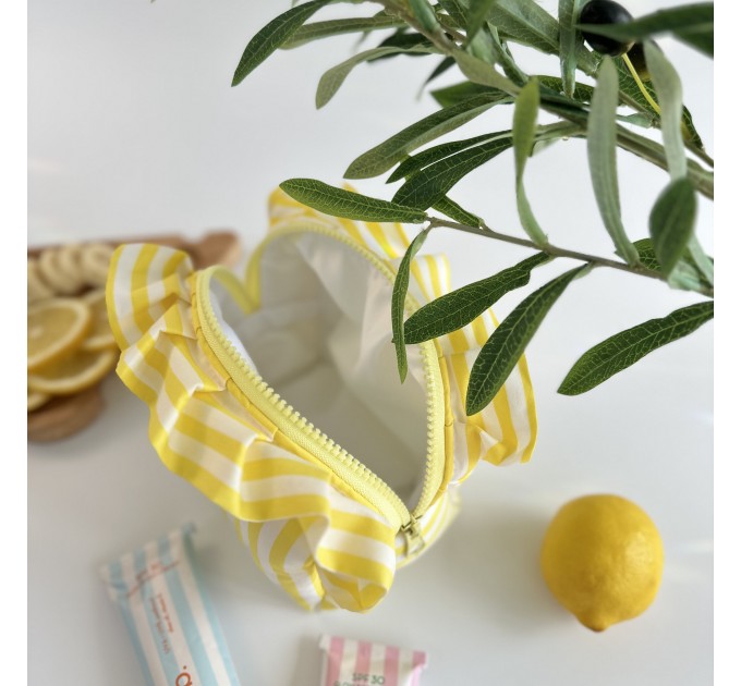 Small yellow striped cosmetic bag with ruffles