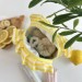 Small yellow striped cosmetic bag with ruffles