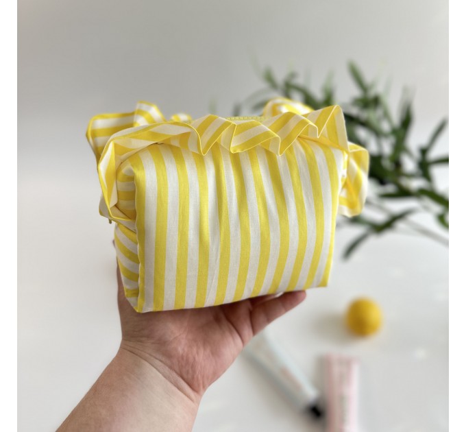 Small yellow striped cosmetic bag with ruffles